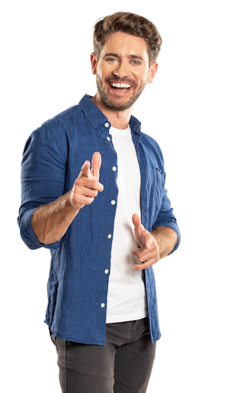 A smiling man standing pointing his finger as if to say do you have your Europass?
